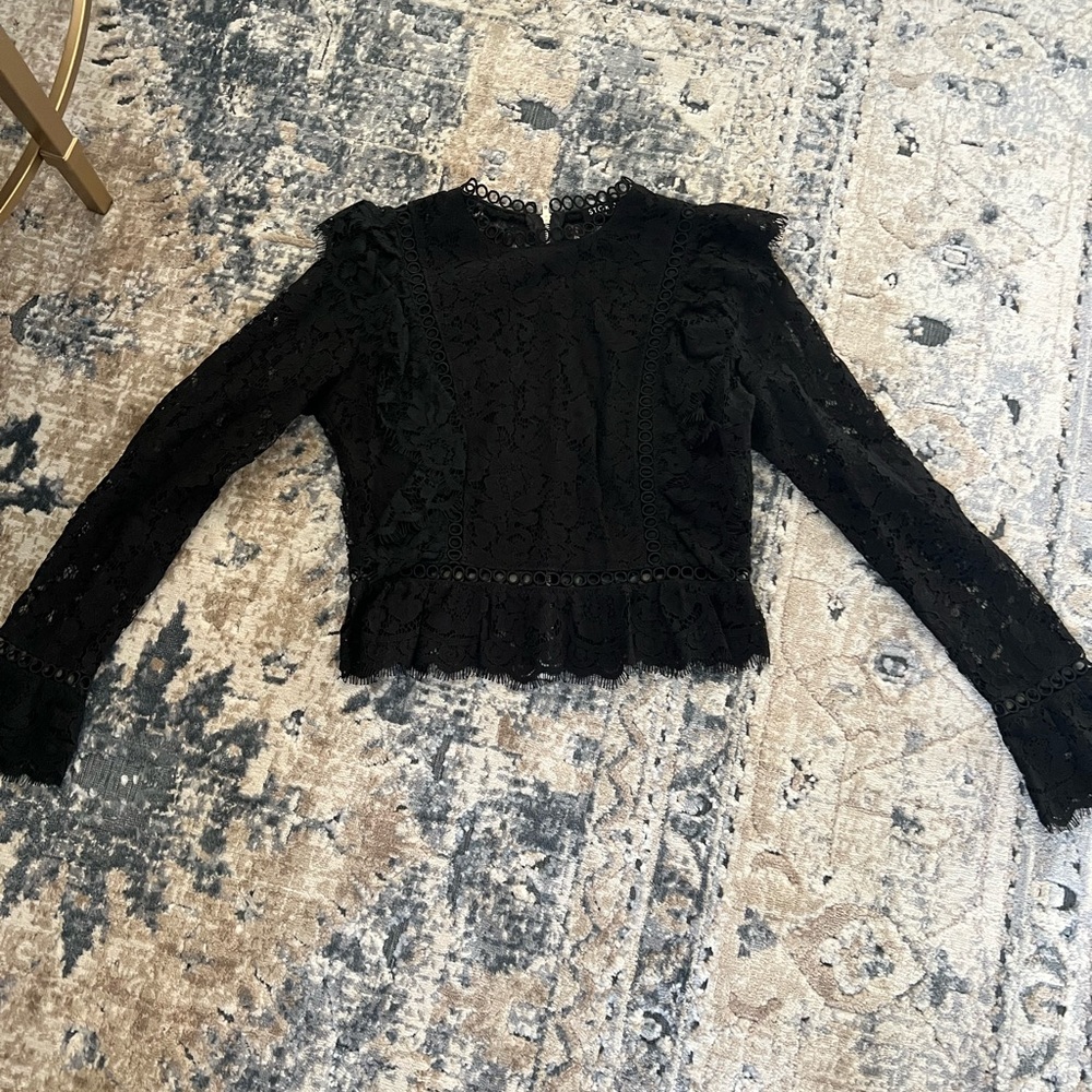 Size S; never worn black long sleeved lace top, with zipper feature on the back